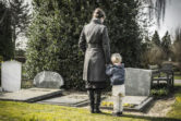 Wrongful Death Attorney: Mother and and son visiting a grave.