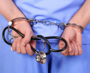 doctor in handcuffs