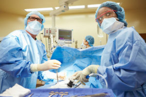 male and female doctors performing surgeries