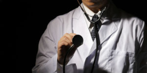 doctor holding stethoscope