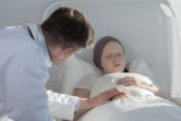 Doctor caring for woman with cancer