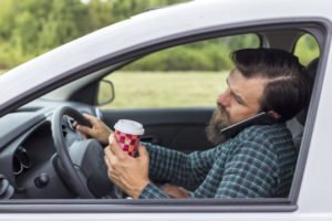 Driver talking on the phone while driving distracted