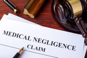 Filing medical negligence claim form.