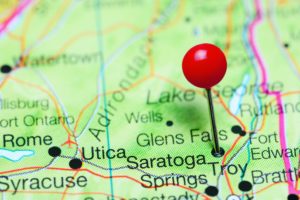 Saratoga Springs pinned on a map of New York state, USA.