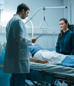 doctor looking over patient
