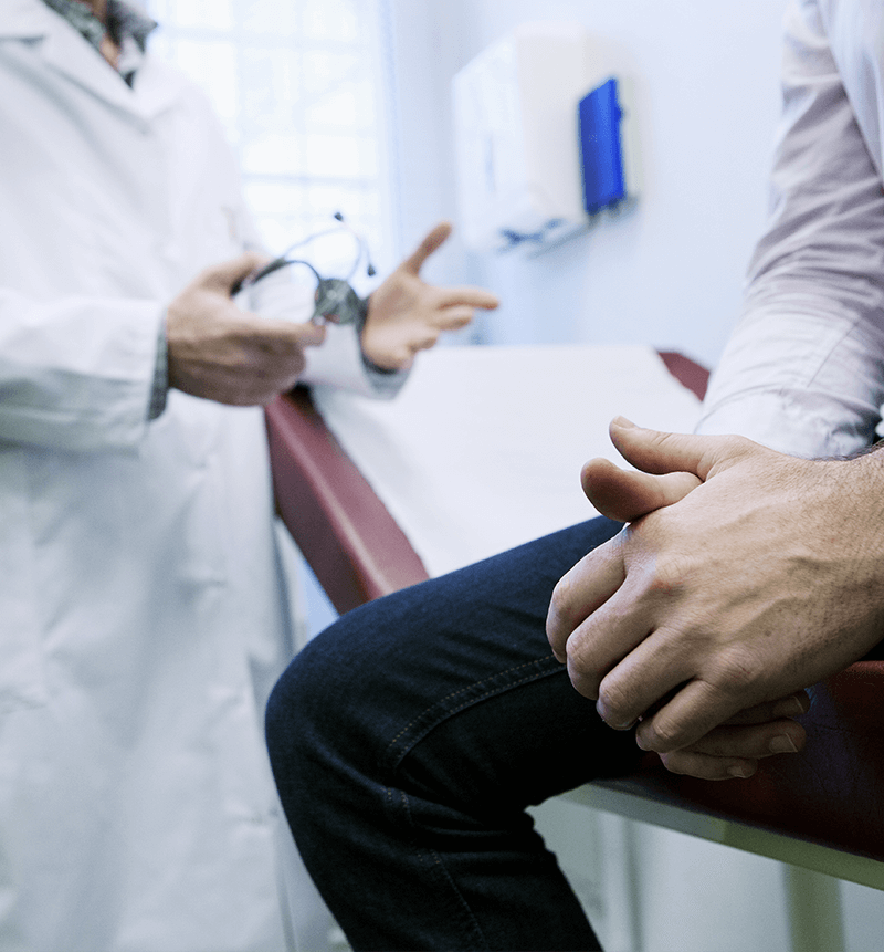 Photograph of doctor talking to a patient